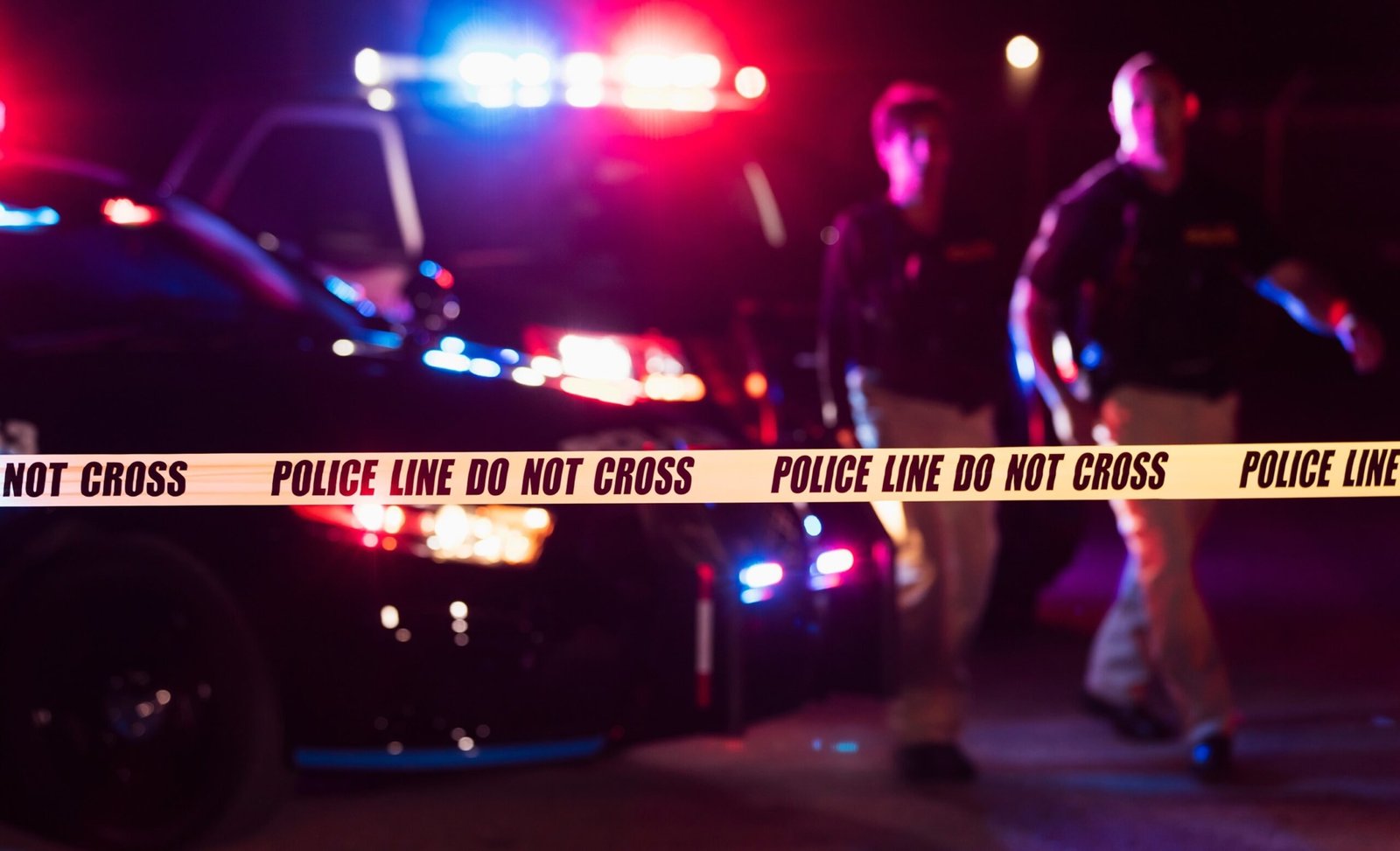 Photo: Police officers and crime scene in a file photo without date.