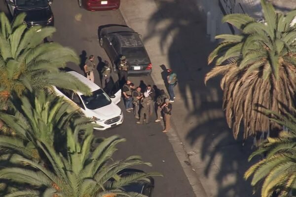 Undocumented Immigrant and Officer Injured in Shooting During Targeted Police Stop