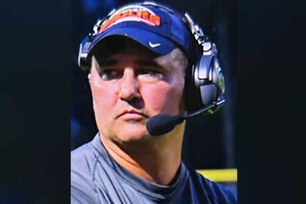 Missing Virginia football coach wanted on child sex abuse charges walked into woods with gun, family says